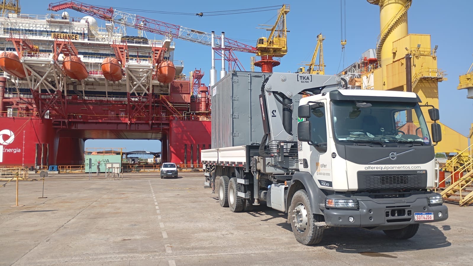 Alfer Volvo crane truck operating at a shipyard
