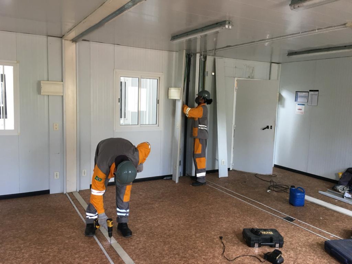 Alfer team assembling a container
